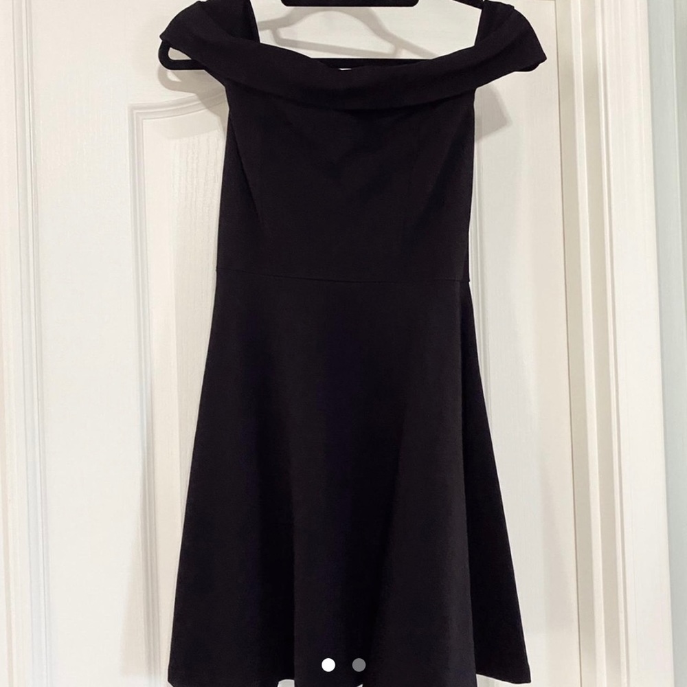 Black formal dress. Never worn. Zipper on back. Mini length